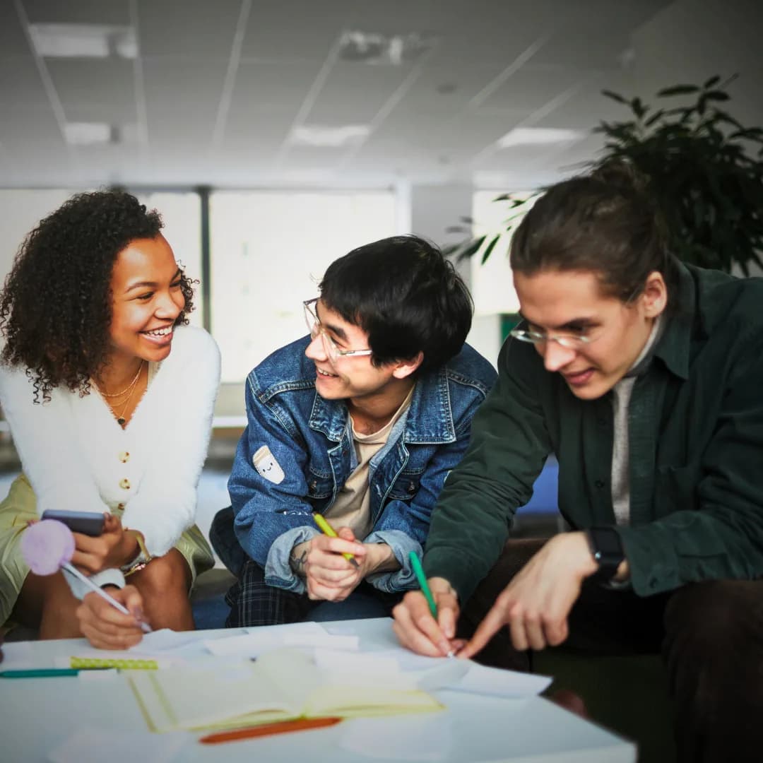 Members collaborating in the REI Workplace coworking space